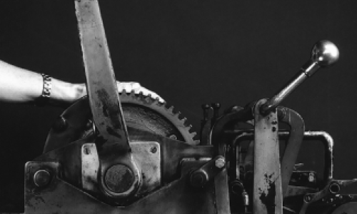 Sandy hands-on and ready to crank at the Vandercook press