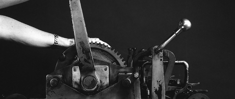 Sandy hands-on and ready to crank at the Vandercook press